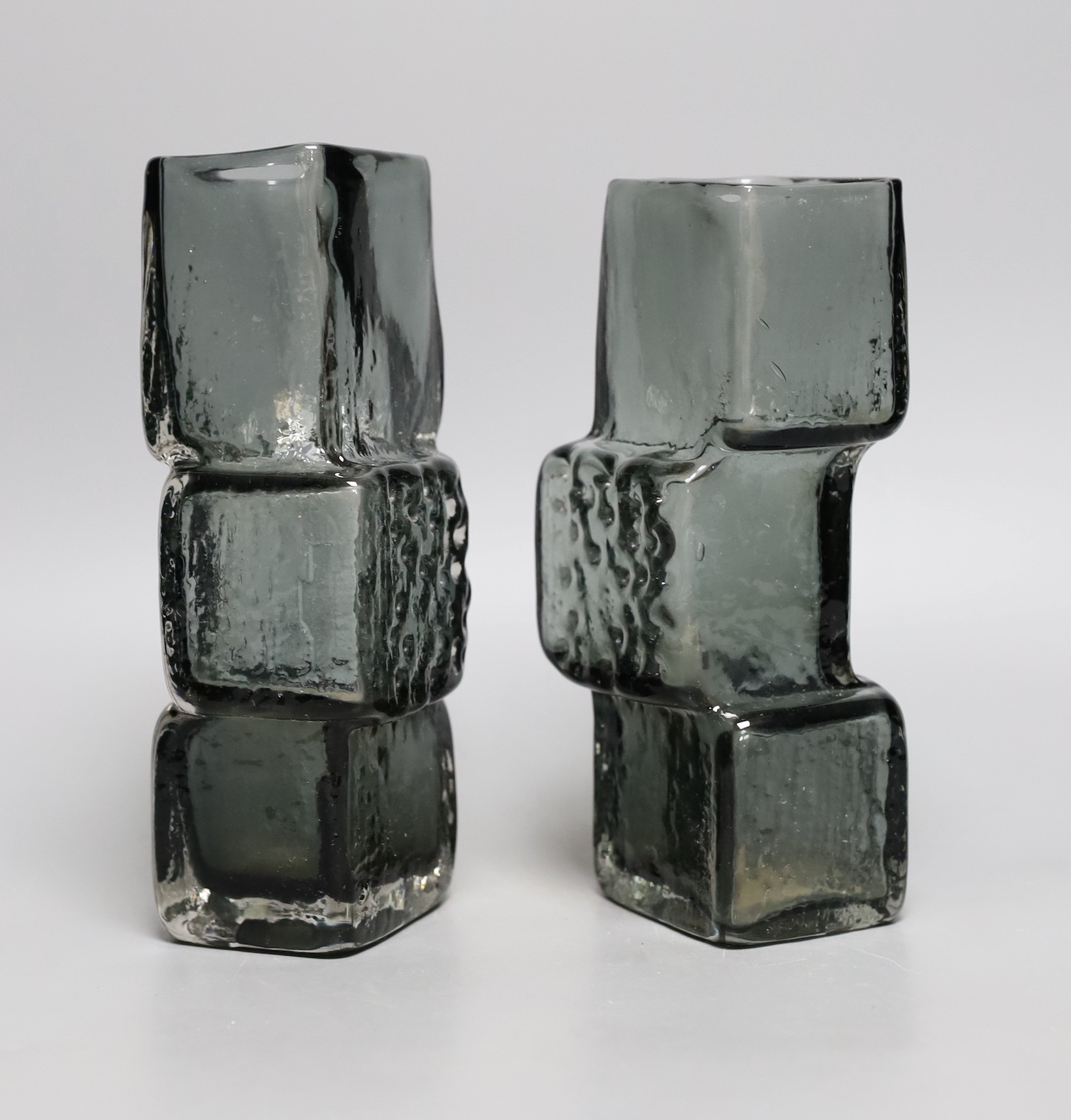 A pair of Whitefriars 'Drunken Bricklayer's' glass vases, designed by Geoffrey Baxter, pattern number 9673, smoked glass, 20cm tall